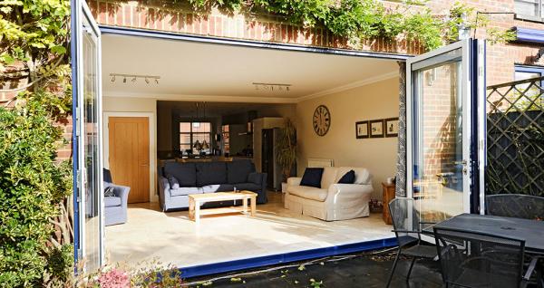 4 part bi folding door set sprayed in a bespoke blue Ral colour has been installed into this modern townhouse in winchester.